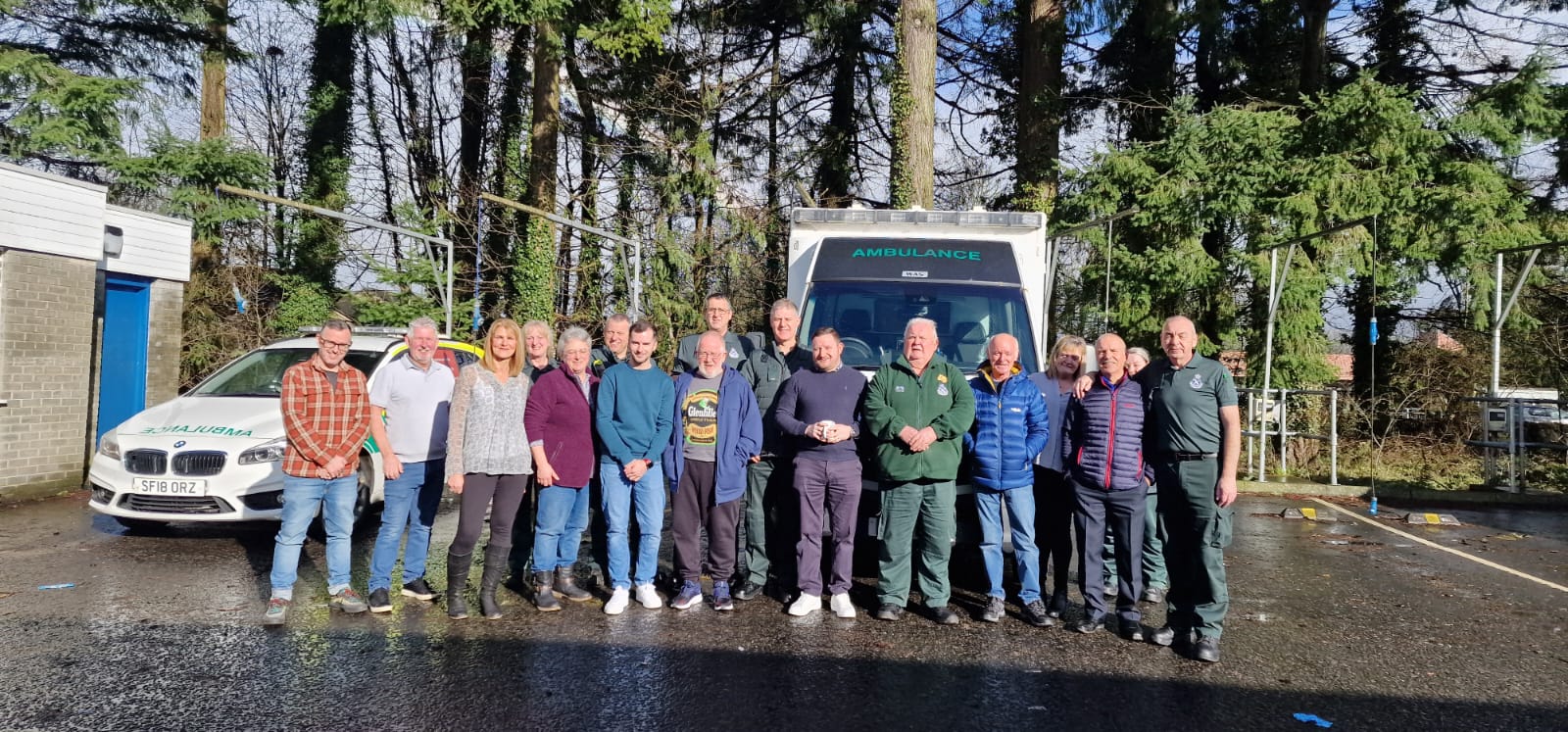 Group shot of Andrew with other staff