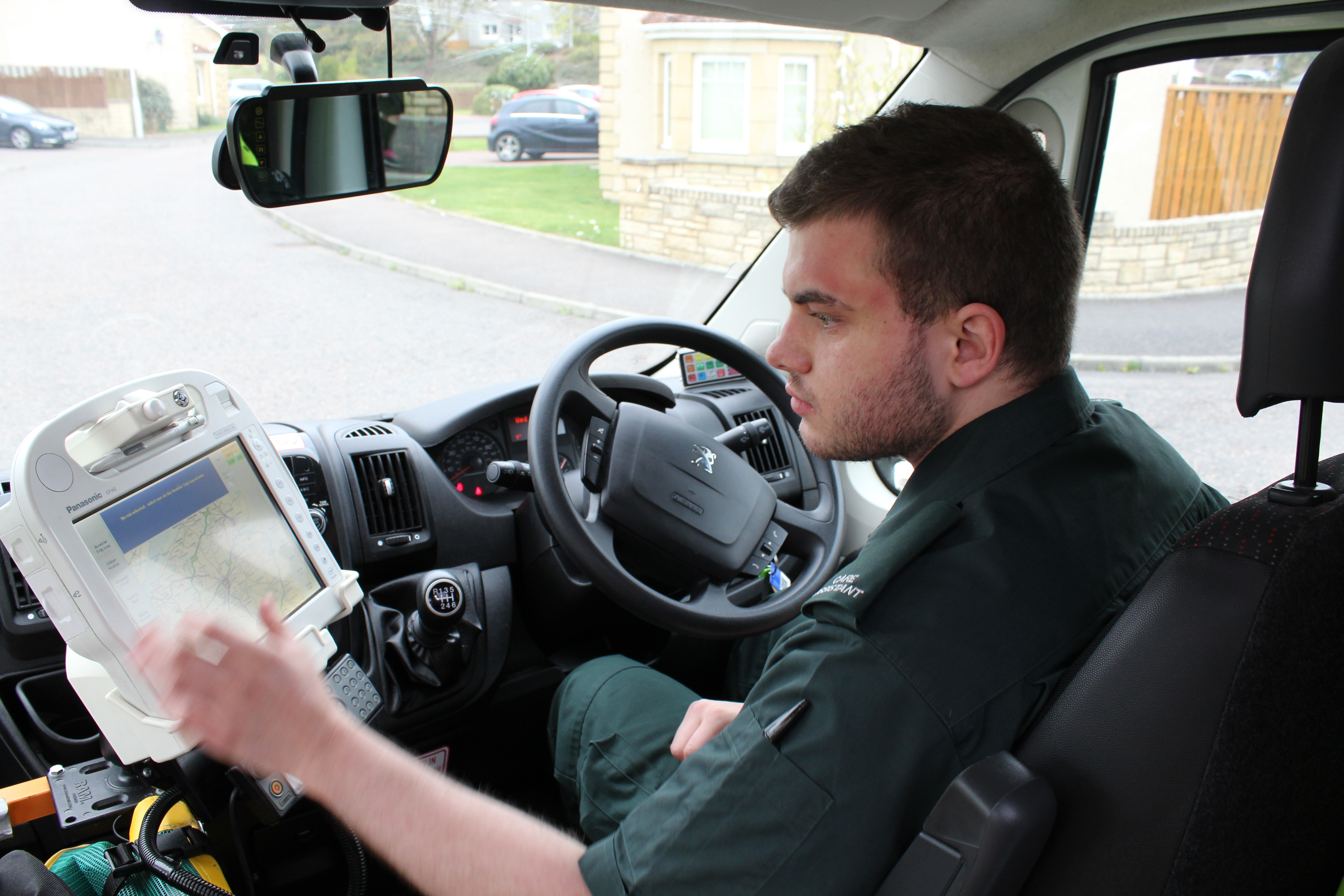 An Ambulance Care Assistant in his ambulance