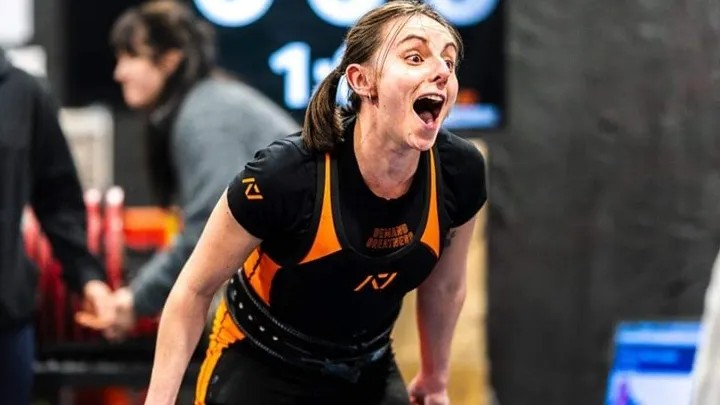 Kayleigh celebrating after lifting 