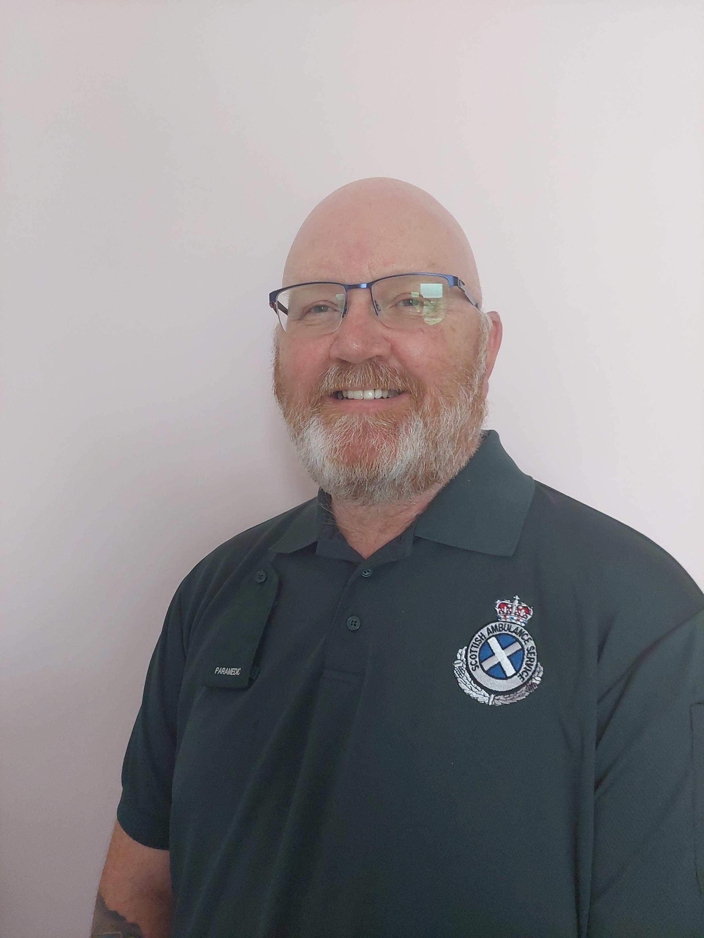 colin smiles proudly in uniform