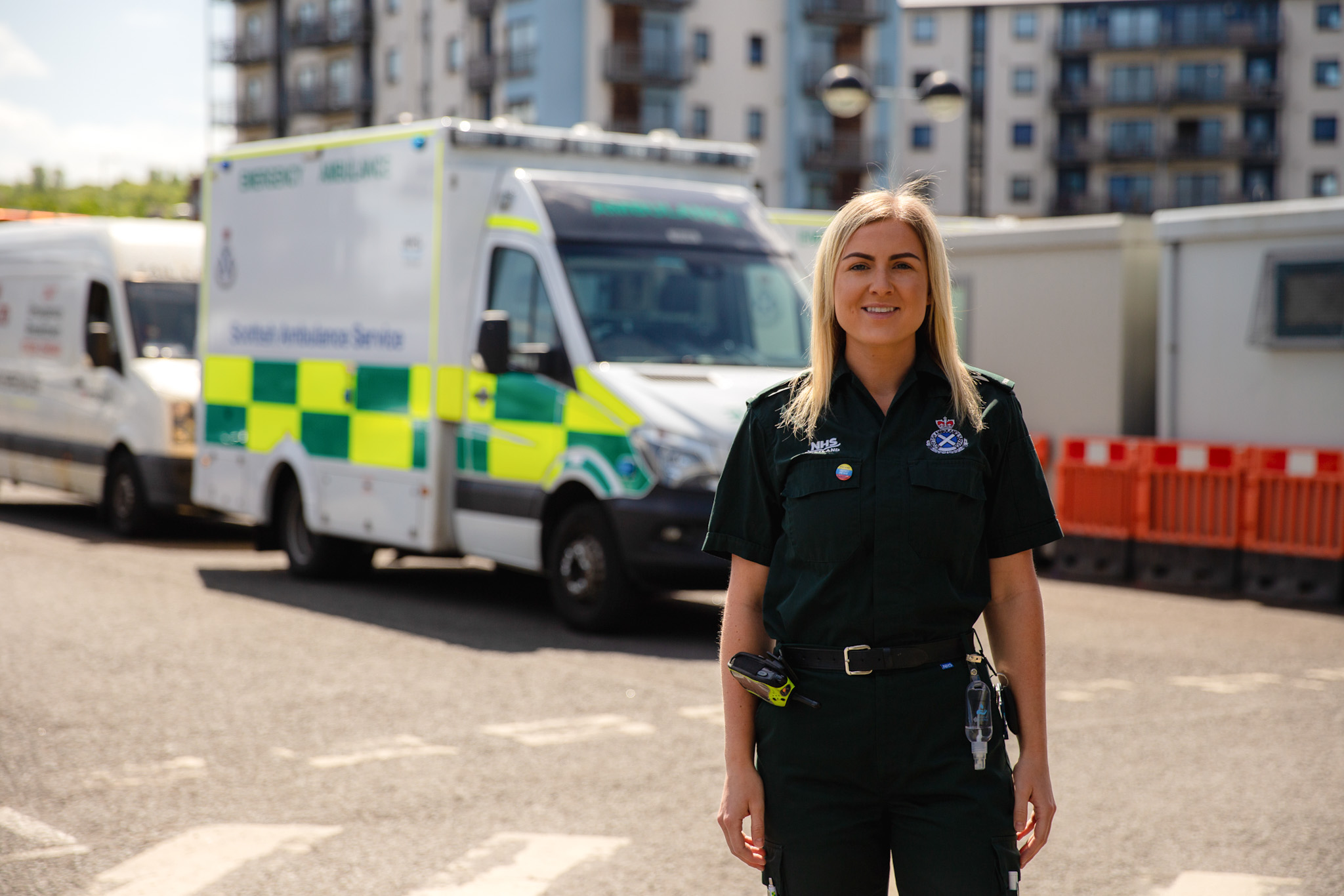 Jenifer Stewart standing in front of an ambulance.