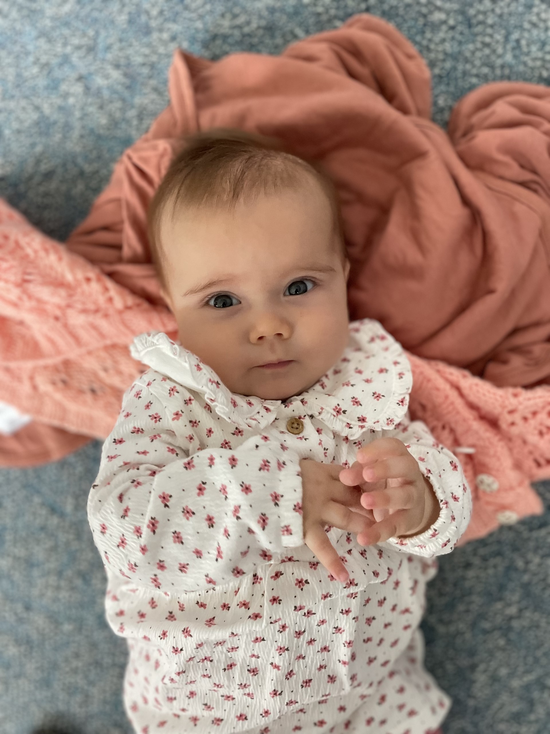 Baby Lucy Mossner looking up at the camera