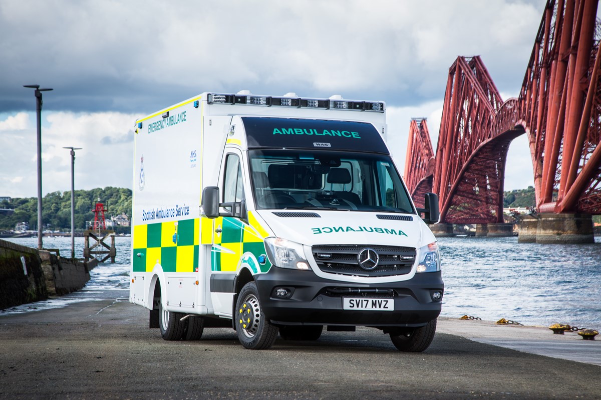 An A&E ambulance in front of the Forth Railway Bridge