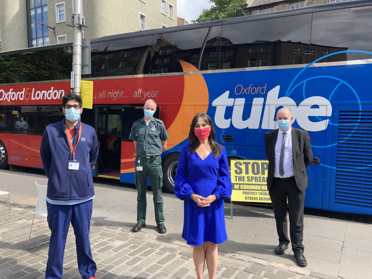Staff in front of the Vaccine Bus