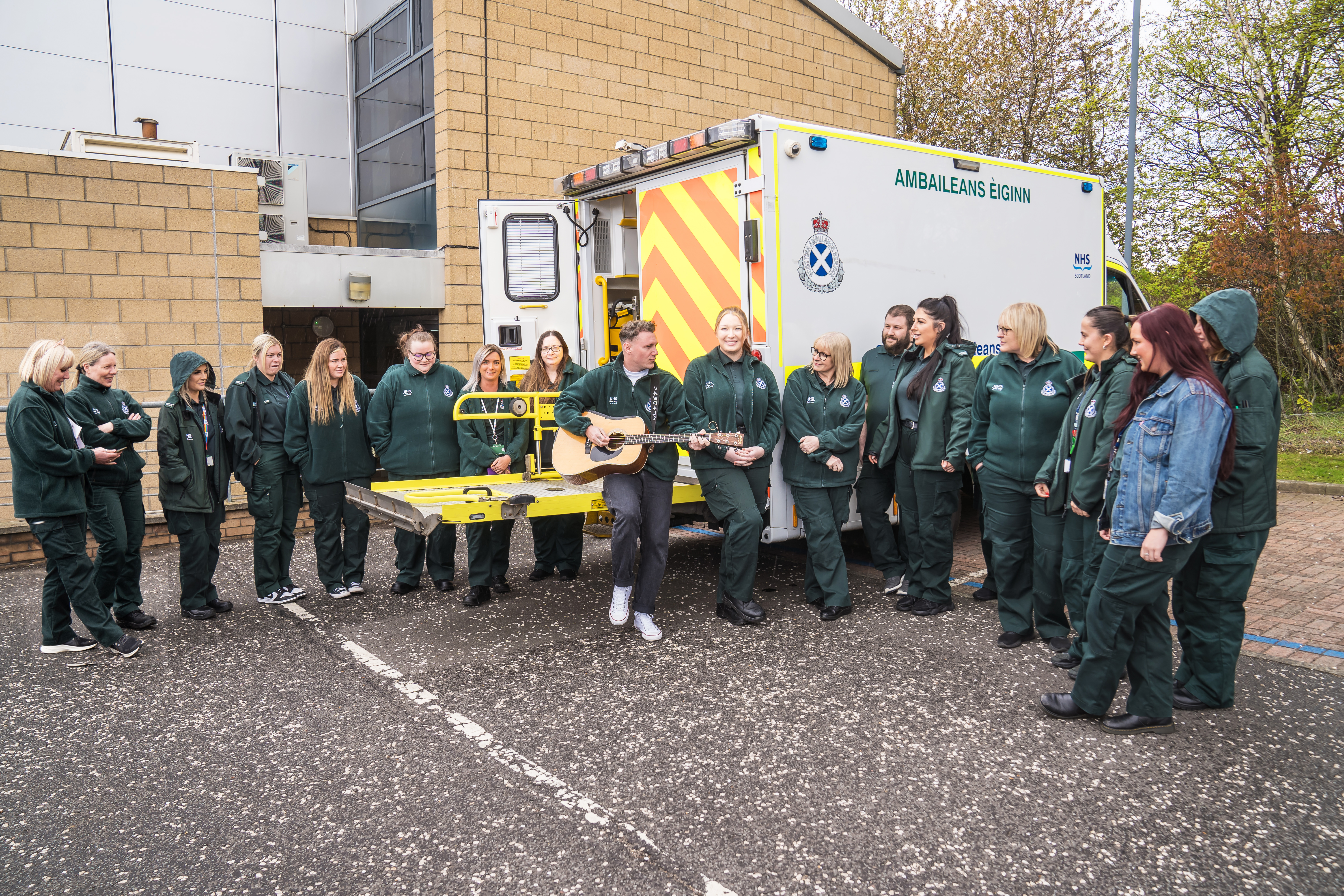 Callum singing a song to staff outside