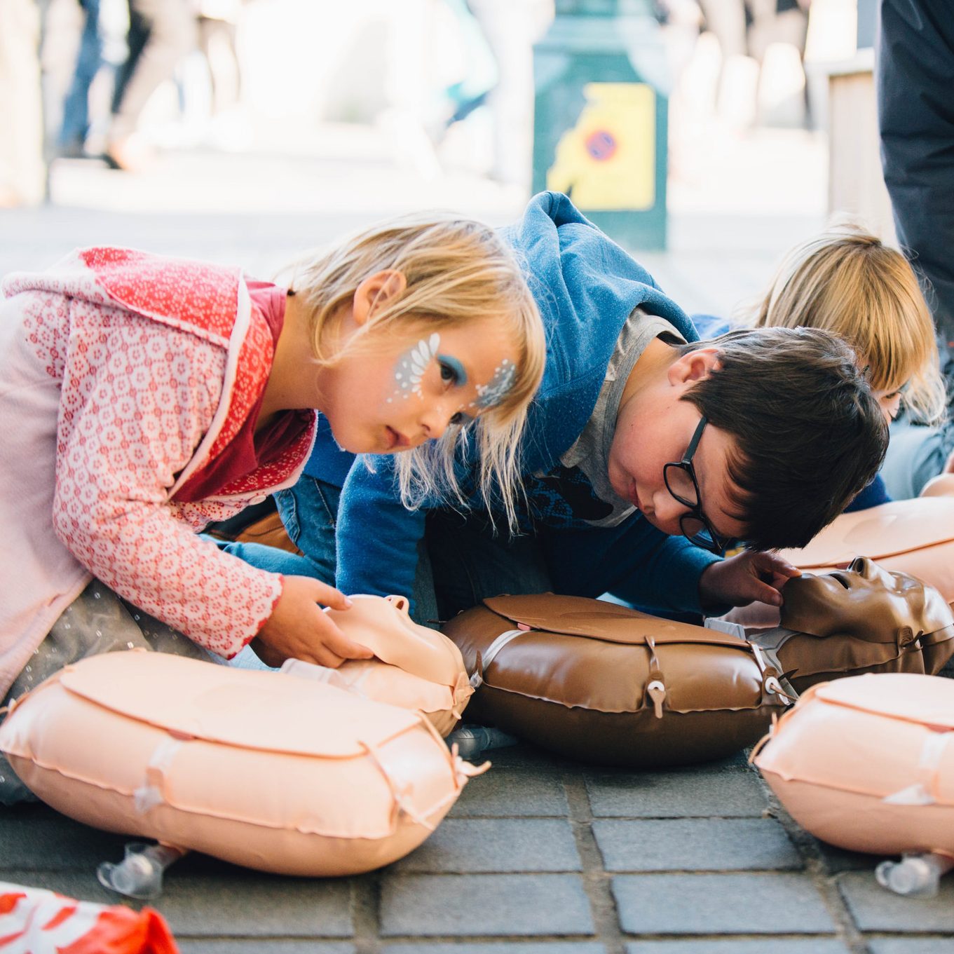 Children learning CPR