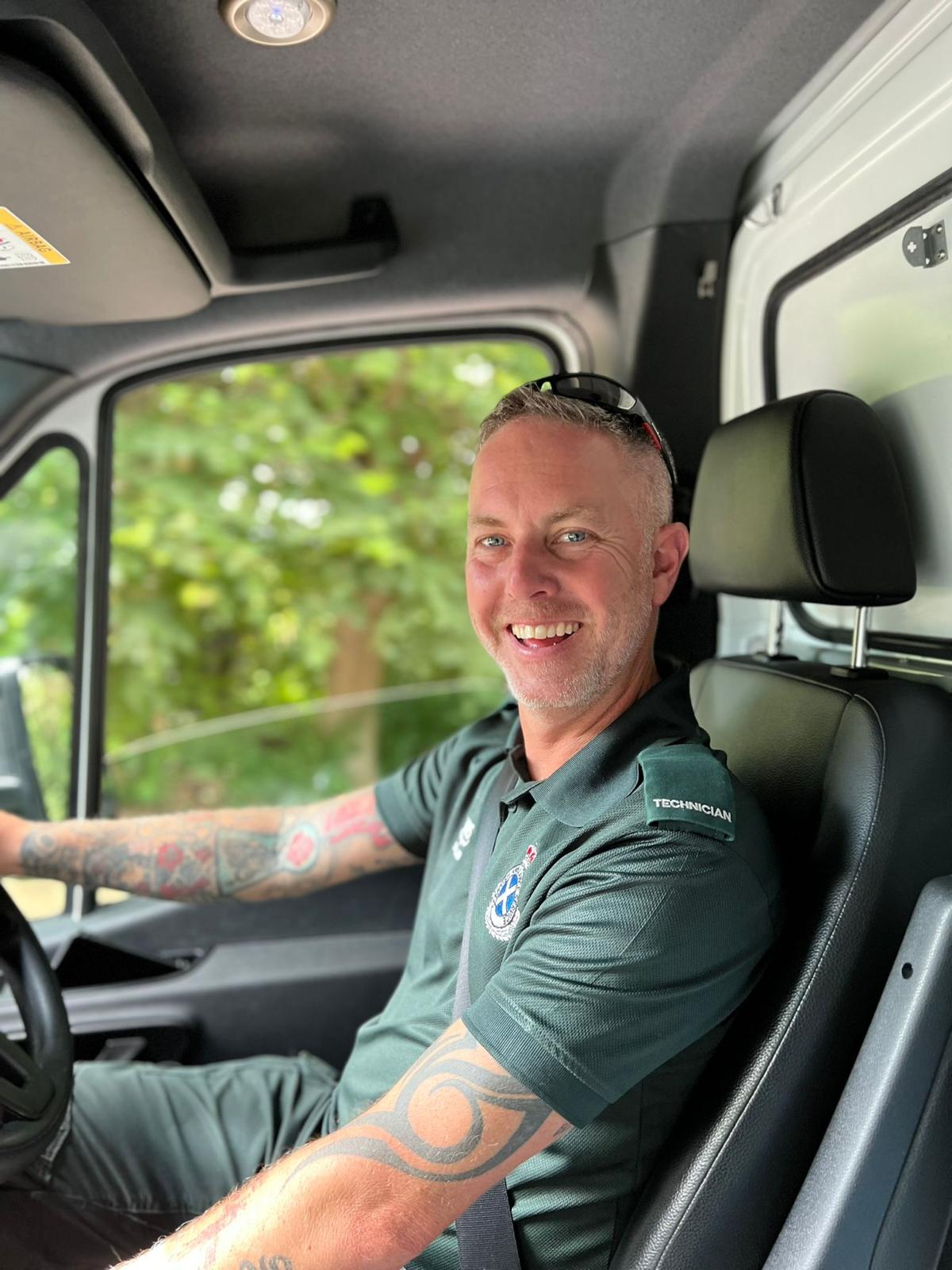 Iain driving an ambulance