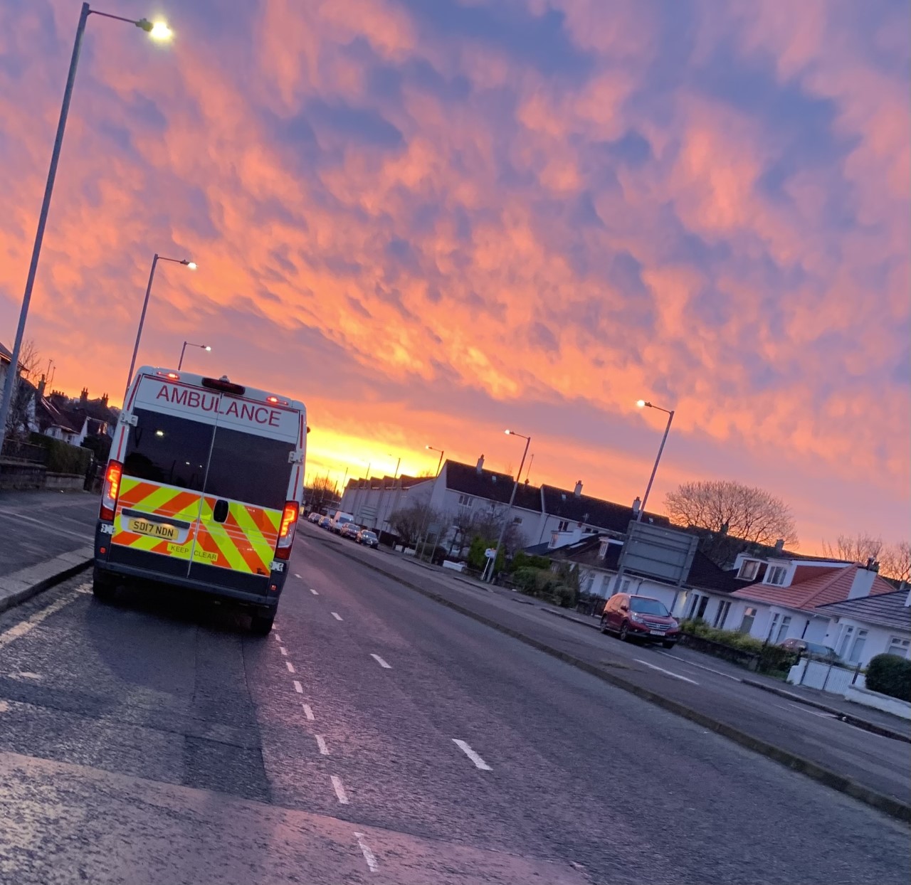 Picture of Scheduled Care vehicle with a sunset in background