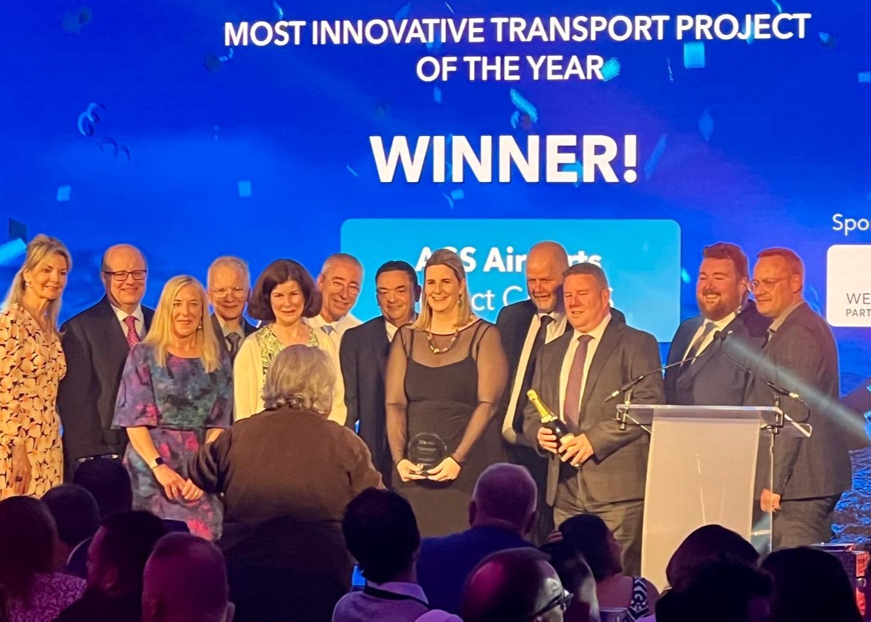 Members of the Project Team on stage at the awards ceremony with their trophy