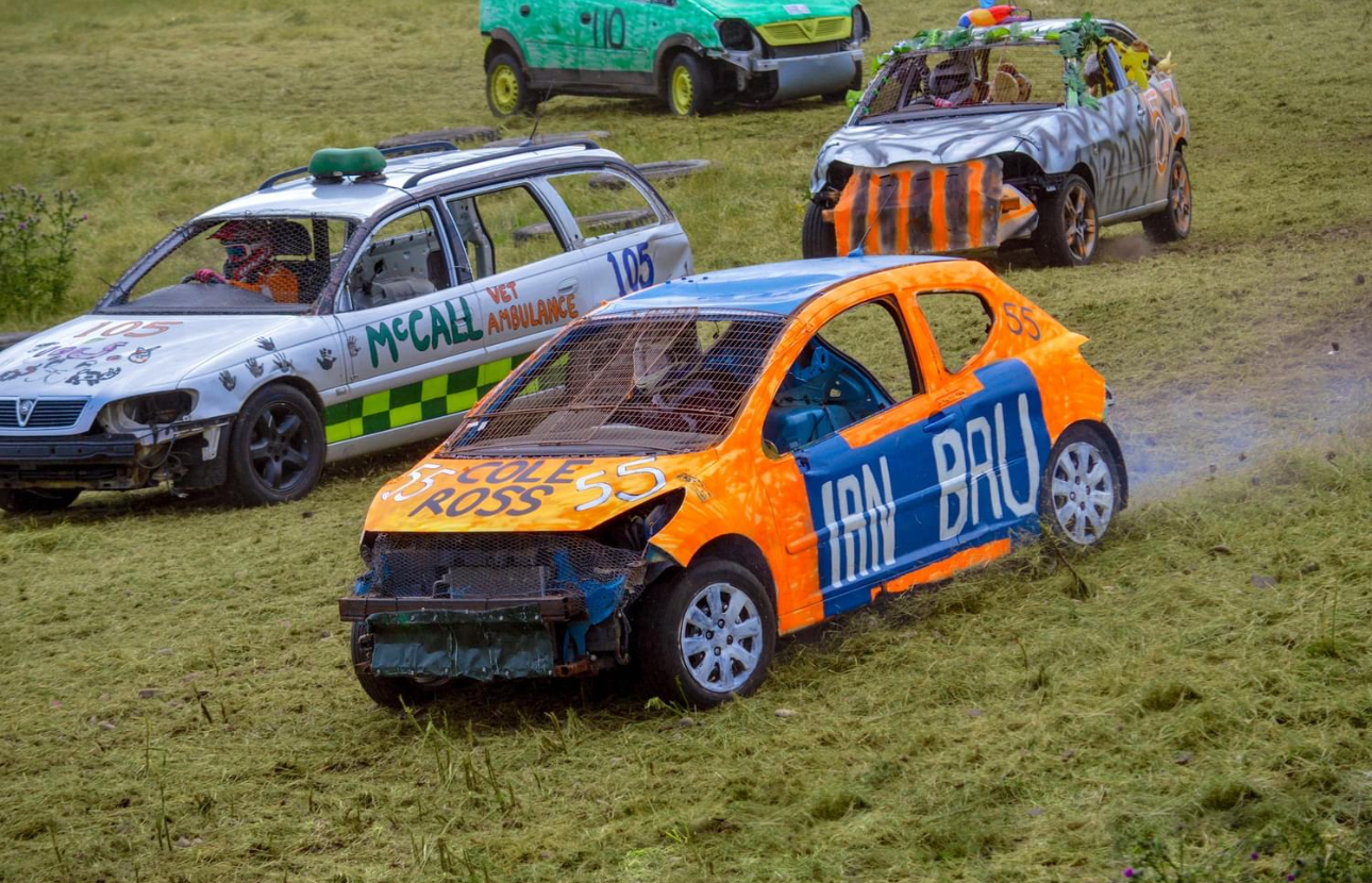 Cars covered with advertising racing each other