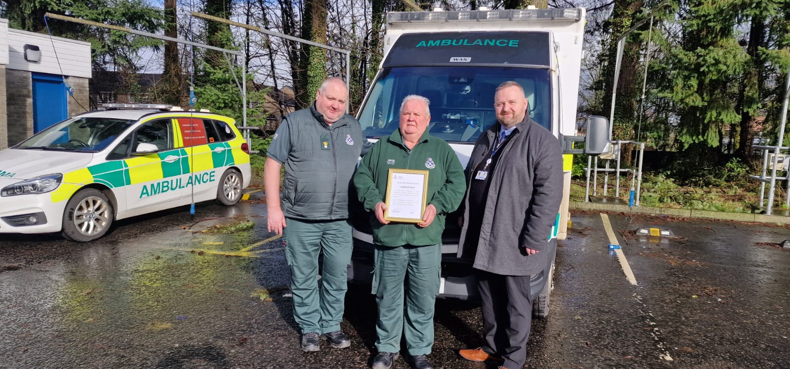 Andrew Reid presented with a certificate 