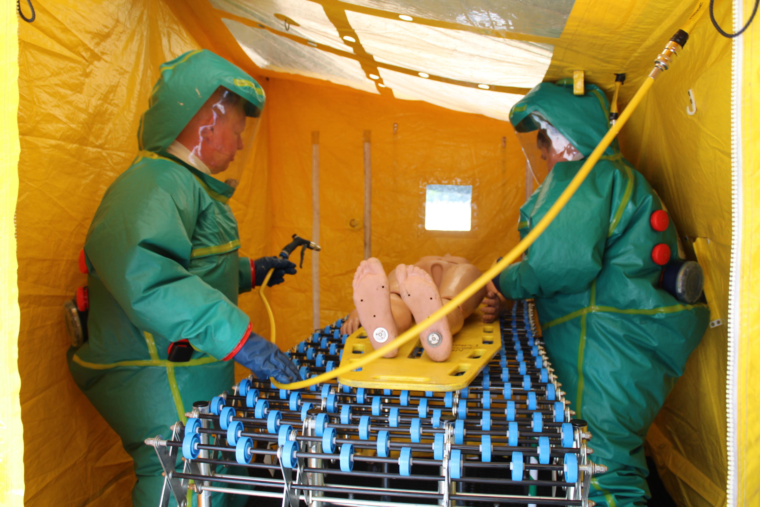 SORT staff members in HAZMAT suits doing an exercise