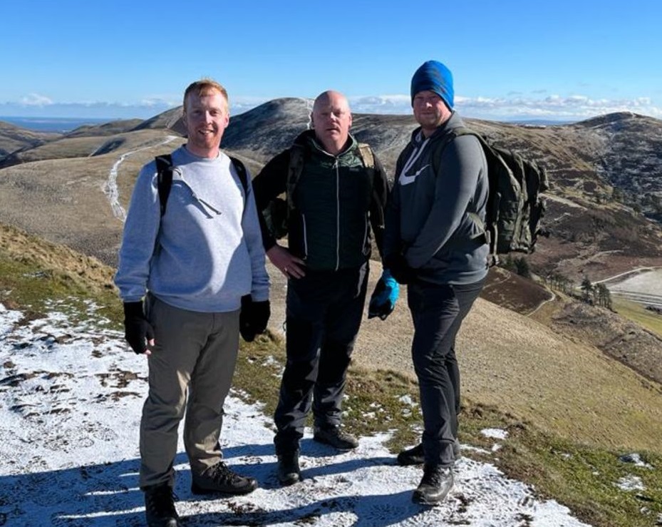 Pictured are Iain, Graeme, and Nick at the top of the Pentlands