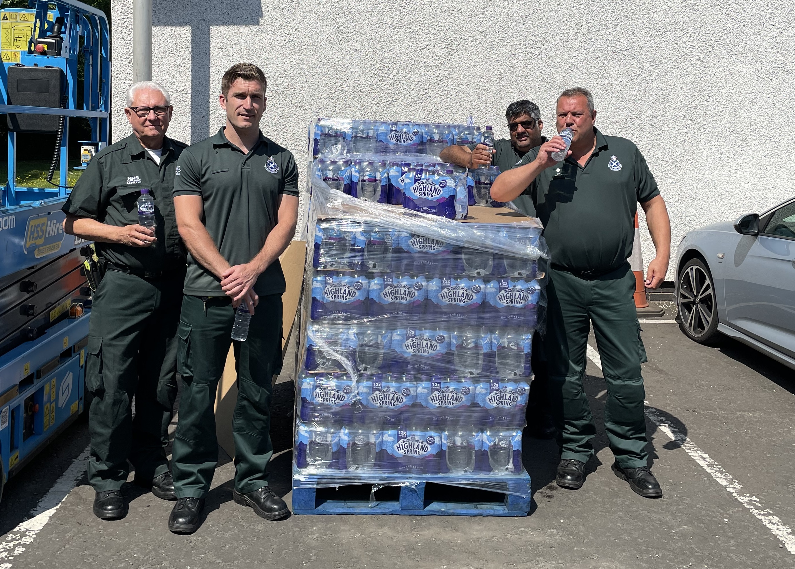 Ambulance service staff with bottles of water
