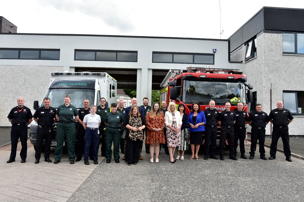 Staff and vehicles in front of Clarkston station