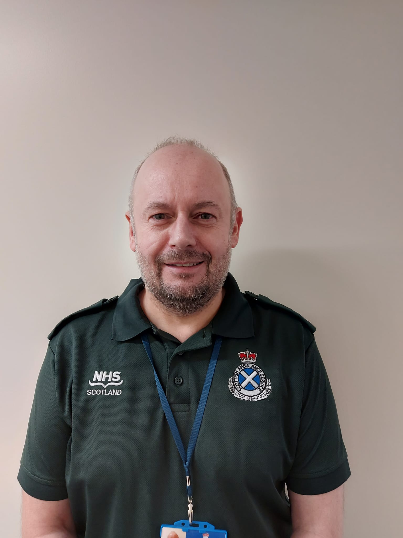 Kenny in SAS uniform smiling at news he received award