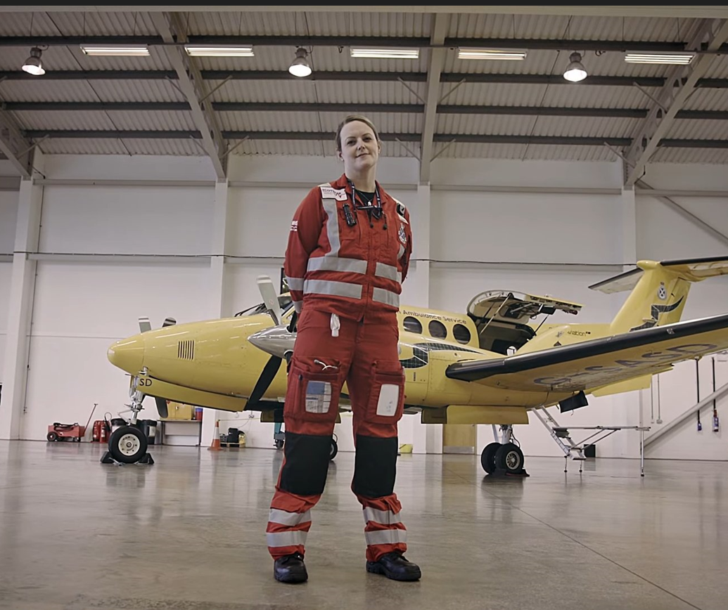 Yvonne Gibson in front of a King Air