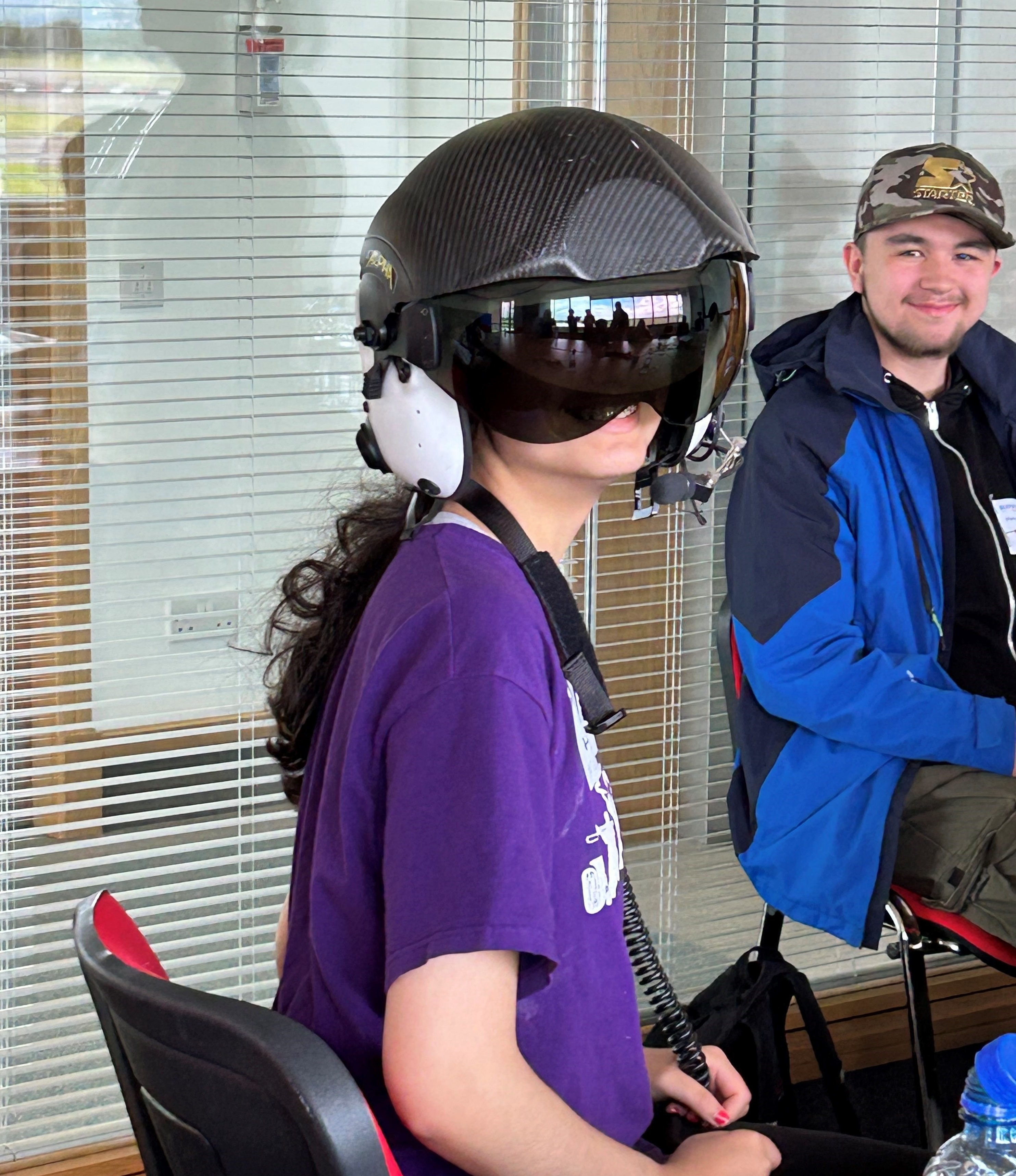 Mariam Rahman Trying On The Air Ambulance Pilot Helmet