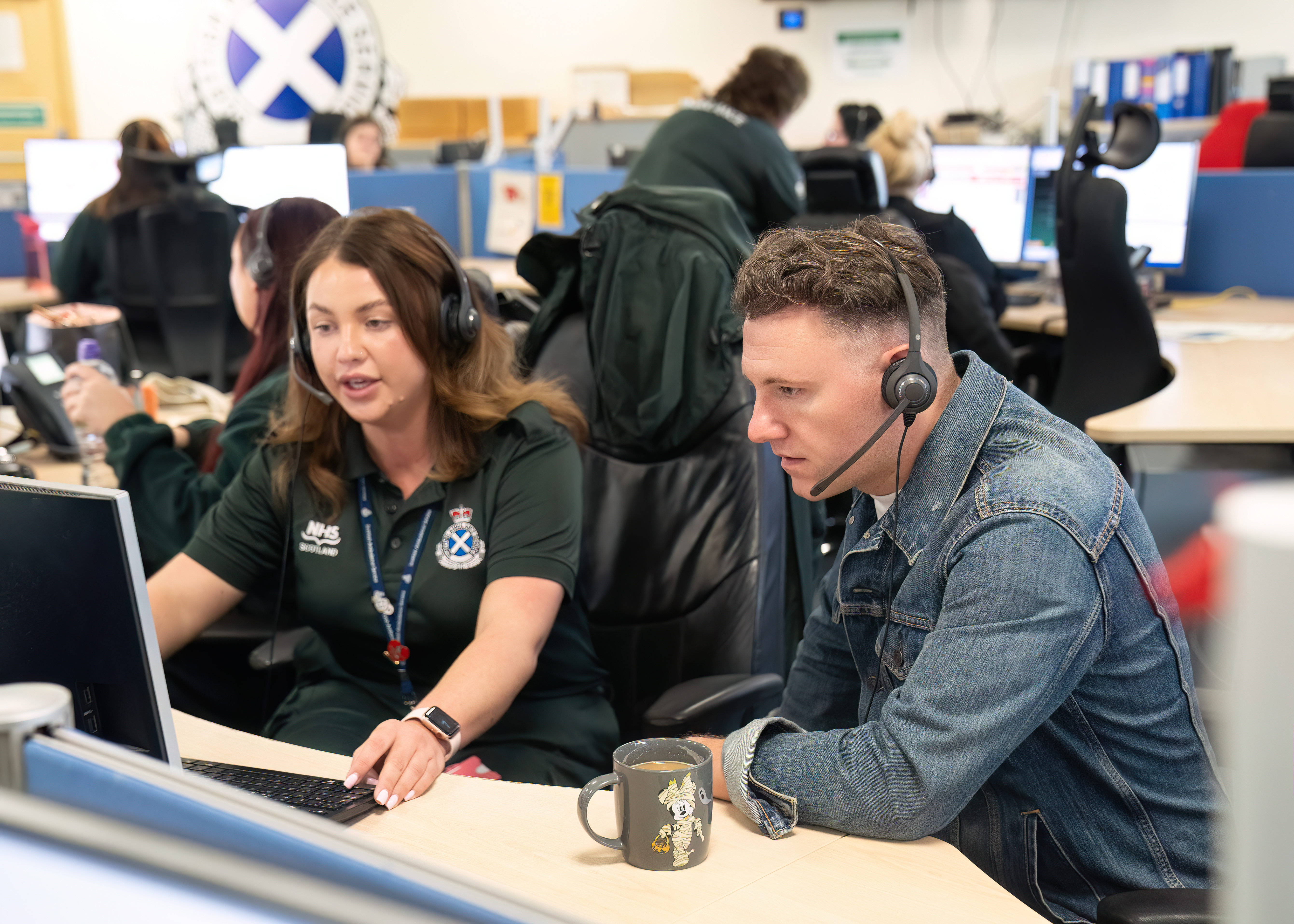 Callum Beattie listening to a call