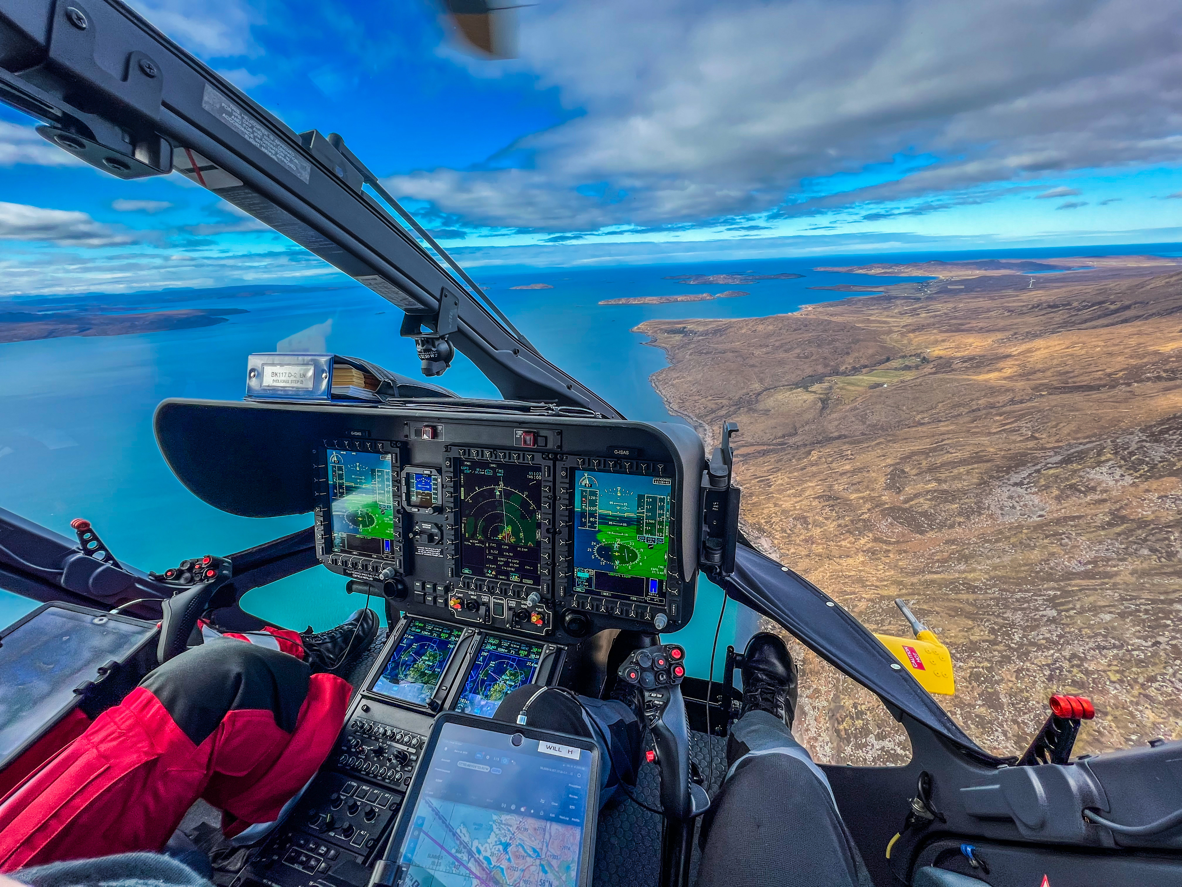 Looking down form a helicopter to the coastline below