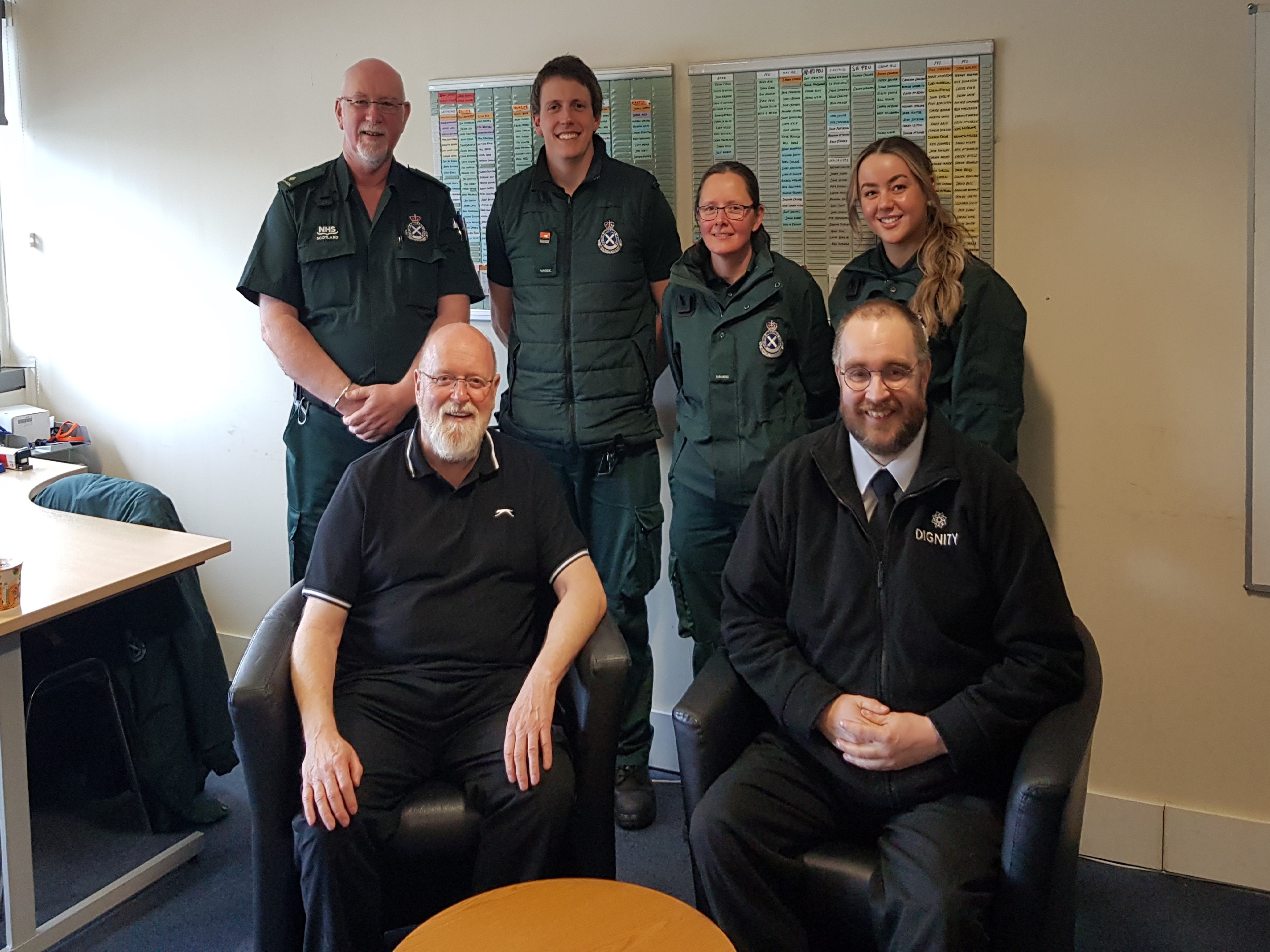 Gerry and Chris sit in front of the Ambulance crew