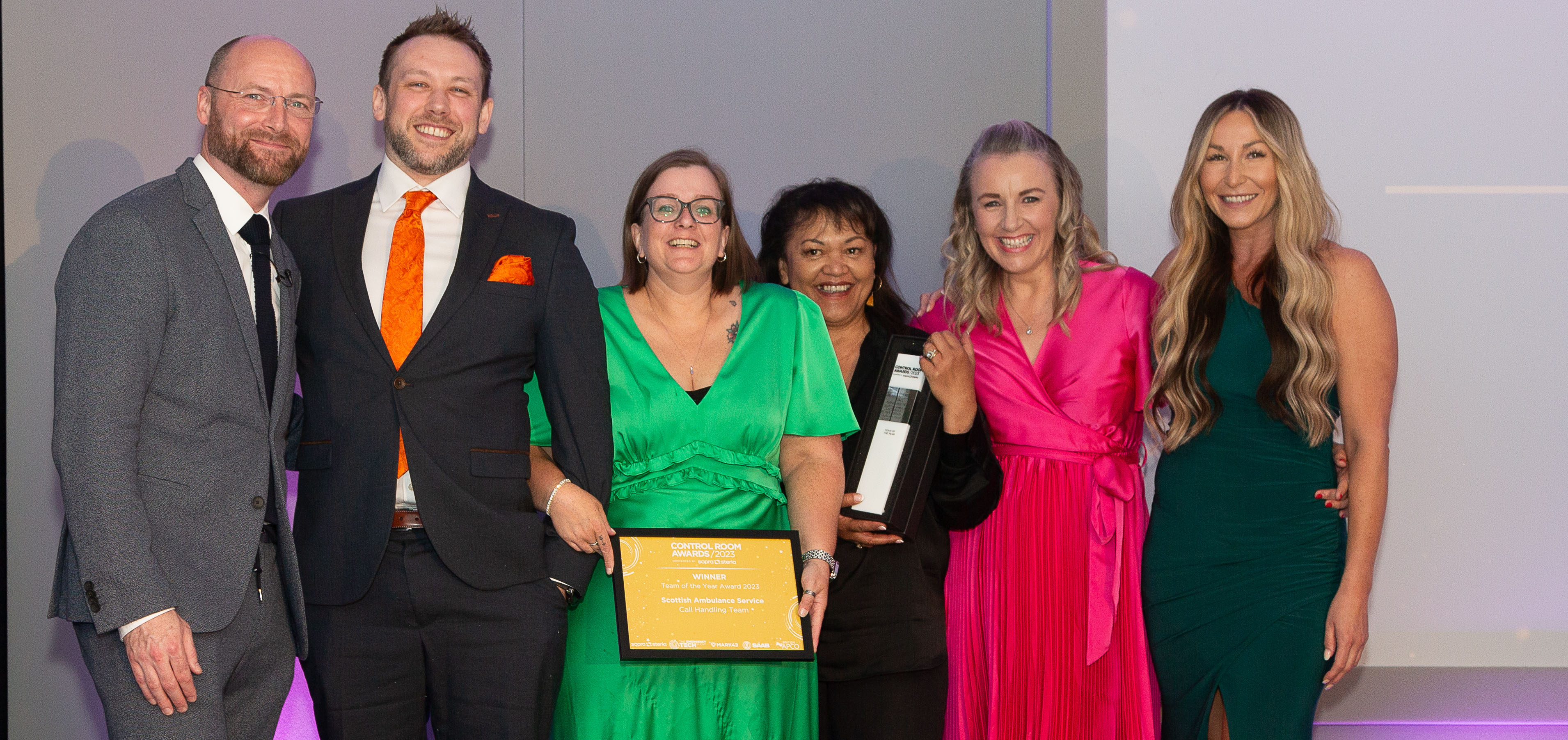 The winners with their certificate and trophy