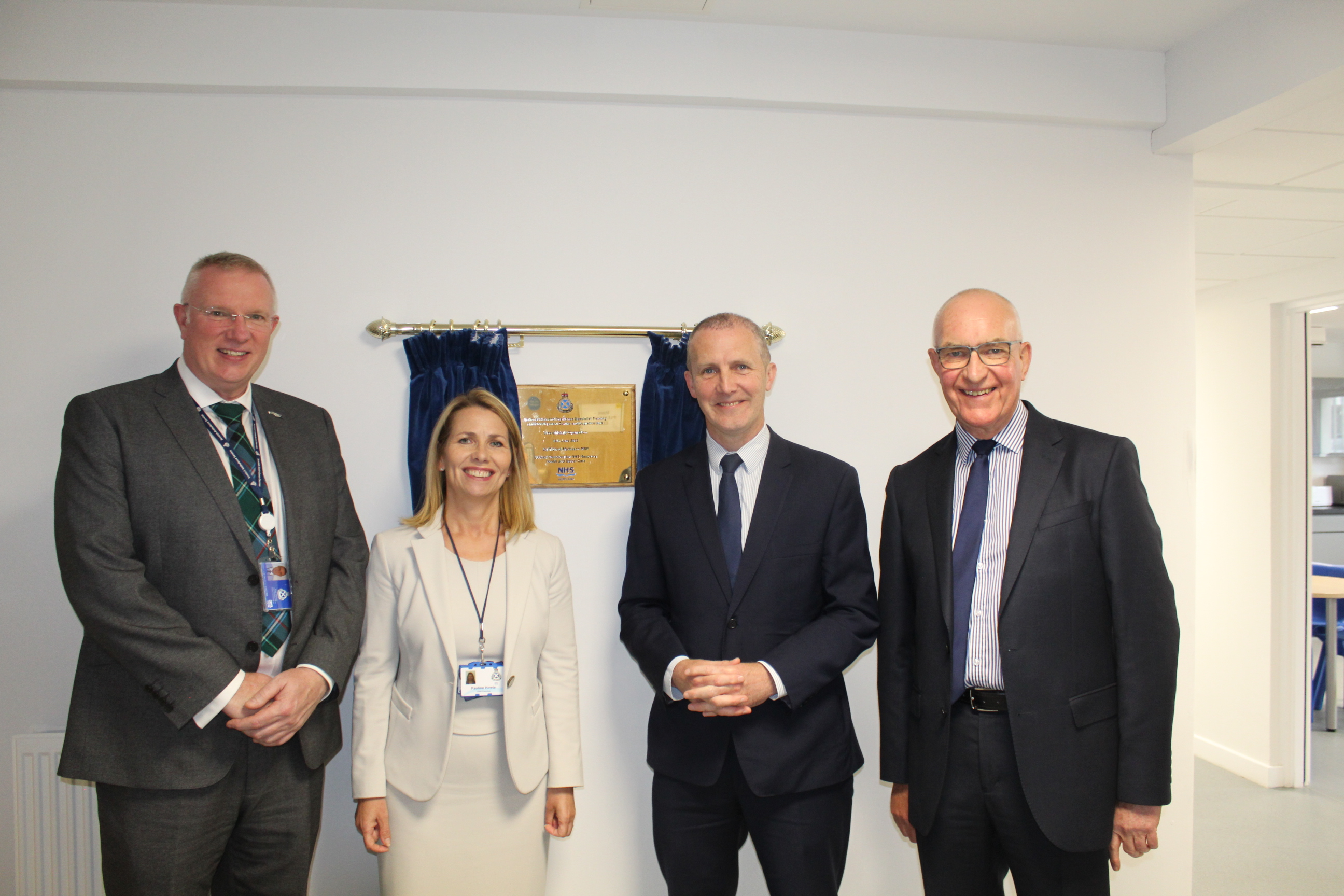 Paul Bassett, Pauline Howie, Michael Matheson and Tom Steele at the plaque
