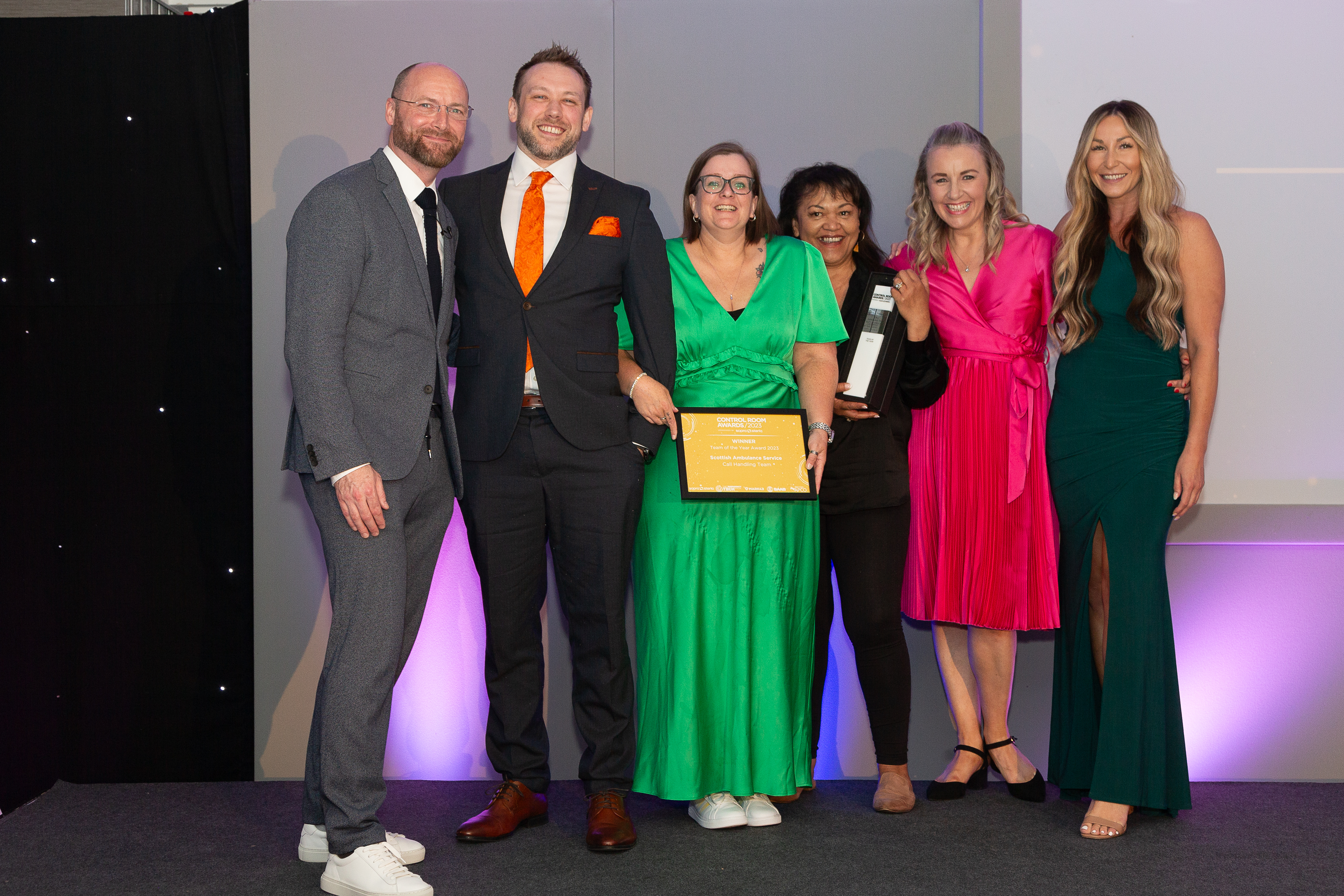 The winners with their certificate and trophy